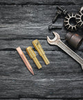 Metal chucks of Spot Weld Dent Puller Kit With Metal Chuck For Car And Sheet Metal Repair on wooden background