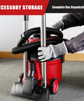 Person organizing Corded Canister Vacuum With Bag, 3 Gallon Capacity, 26 Foot Cord, One And A Quarter Inch Hose