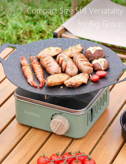 Kickin Mini Butane Camping Stove With 8205 BTU Output grilling sausages and vegetables outdoors on a patio.