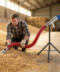 Man using Portable Grain Suction Auger Pump Workhorse For Cement Fertilizer And Gravel With High Efficiency Screw Conveyor And Stainless Steel Feed Inlet 237In Length Easy To Use For Home And Small Vehicle Use in a barn.
