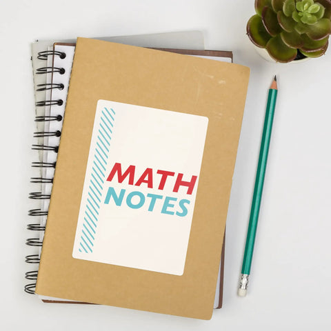 Notebook cover labeled 'MATH NOTES' with colorful text, green pencil, and succulent plant on a white surface.