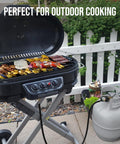 Outdoor grill connected to a propane tank using Propane Hose Adapter 1lb To 20lb With Gauge 6 Foot LP Gas Hose Converter.