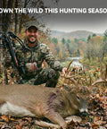 Hunter with crossbow kneeling beside a deer in a forested area, exemplifying hunting success and wilderness experience.