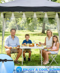 Family enjoying picnic under gazebo with Plug And Play Outdoor Misting Kit 50 Feet Installation Free With Built In Water Filter.