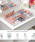 SimpleSort 10 Piece Stackable Clear Drawer Organizer Set with Multi Size Trays for Makeup Vanity and Office Desk Storage BPA Free American Made Clear Plastic Dividers That Keep Your Gear Neat, Accessible, and Ready to Grab displayed on a vanity table holding makeup items like brushes and palettes.
