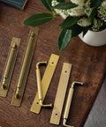 Antique Brass Cabinet Pulls With Backplates, Solid Zinc Alloy Kitchen Drawer Hardware, Crest Wave Plate Style, 2 Pack on table