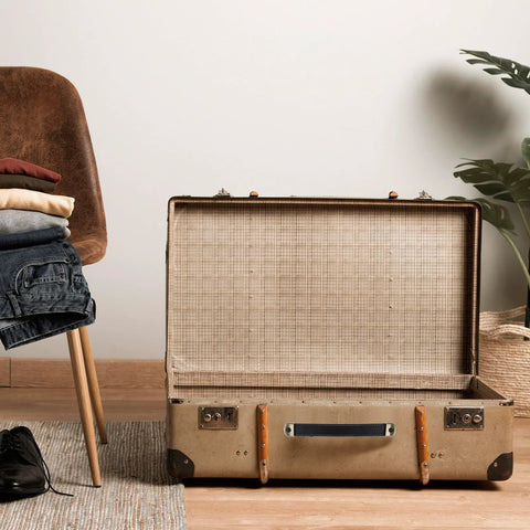 Open vintage suitcase on floor showing two leather handles for drawers cabinets and luggage with mounting screws, soft-touch leather