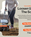 Person using Beast Compact Gas Powered Mini Tiller Cultivator With 52cc Engine 1.8HP in a garden, focus on tiller in soil.