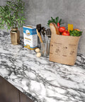 Grey Marble Contact Paper For Countertops Peel And Stick Waterproof Self Adhesive Marble Wallpaper For Kitchen And Bathroom Countertop Upgrade DIY Glossy Removable Home Decor 30 By 118 Inches with groceries and kitchen items on marble surface.