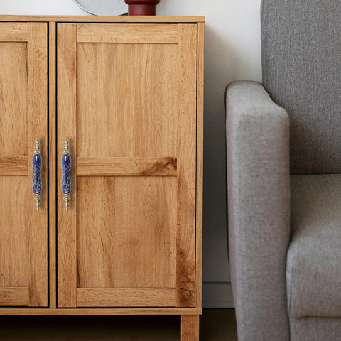 Wooden cabinet with Chinese Style Ceramic Cabinet Pulls Set Of 4 In Antique Bronze With Screws, next to a grey couch