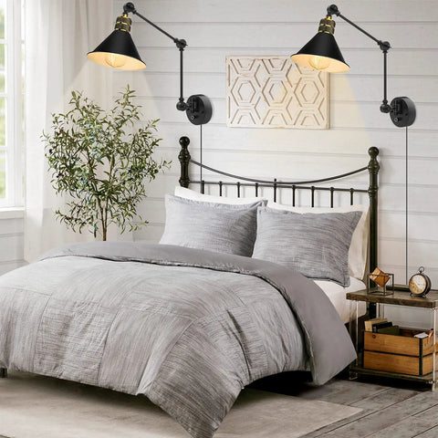 Plug In Wall Sconces Set Of 2 With Dimmable Rotary Switch Two Swing Arm Industrial Wall Lights on a bedroom wall above bed.