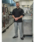 Badass Short Sleeve Chef Jacket In Sharp Black features double breasted front, worn by chef in commercial kitchen.