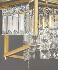 Close-up of gold square frame and black crystal accents of Modern Foyer Chandelier With Black Crystal And Square Metal Frame.