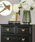 2 Pack Butterfly Cabinet Knobs In Gold Pewter With Delicate Wings And Lifelike Antennae Bringing Whimsical Vibes To Girls Room Dresser Vanity Hardware on black dresser with clock and flowers