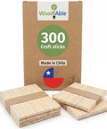 Totally Splinter Free Popsicle Sticks Bulk Pack Of 300 Natural Wood Craft Sticks 4.5 Inches Long in a box with stacked craft sticks.