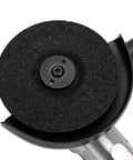 Hulking Five Inch Pneumatic Angle Grinder Dropping 11000 Rpm Of Wild Air Power For Totally No Sweat Cutting Smooth Grinding And Ridiculously Quick Polishing On Grease Monkey Projects, close-up of grinding wheel.
