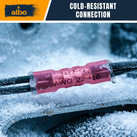 ALBO pink insulated heat-shrink butt connector on two black wires, AWG 22-16, close-up