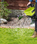 Person using Cordless Grass Seed Spreader For Lawn Care With Ryobi 18V Battery Compatibility Fertilizer And Salt Ice Melt Spreader Handheld Tool Only