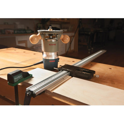 Top Shelf Router Dado Jig With CNC Machined Aluminum Carriage And One Inch Precision Bushing on workbench with router and guide.