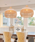 Dining room with two Rattan Chandelier 1 Light Boho Coastal Wicker Handwoven Pendant Lights, natural with white accent stripes, 15.74 inches wide and high, eco-friendly.