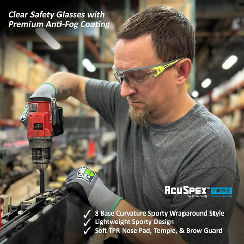 Premium Lightweight Frameless Safety Glasses with Killer Antifog Lens and Rock Solid Comfort for Marathon Shifts Bulk Box Includes 144 Pairs Green Gray Wraparound Shield Protection for Construction Crews worn by worker using a drill.