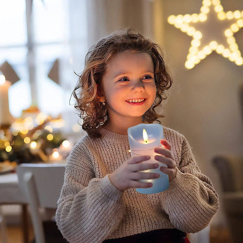 Child holding Cozy Flameless Candle Set With Embedded String Lights 5 Piece Real Wax LED Candles, ivory glow indoors