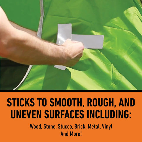 Applying Beast Tough Heavy Duty White Duct Tape 1.88 Inch Wide By 10 Yards Long Pack Of 6 on a green uneven surface, showing versatility.