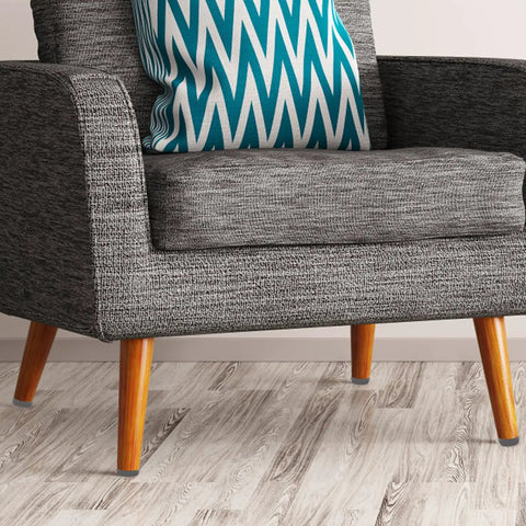 Kick Those Nasty Cabinet And Desk Shakes Flat With Heavy Adjustable Furniture Levelers And Table Feet Screw Direct Install For Chairs Tables And Bookshelves 100 Pack on a gray sofa with a blue patterned cushion.