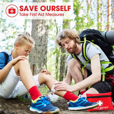 Red mini first aid kit with white cross; 147-piece set for cars, travel, camping, shown beside hikers