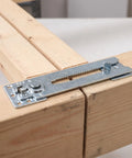 Heavy Duty Sectional Sofa Connectors 4 Pack Interlocking Alligator Style Couch Couplers lock wooden beams together with a metallic clip.