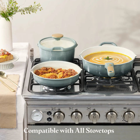 Titanium Nonstick 20 Piece Cookware Set With Detachable Handles on stove, displayed with pasta and soup
