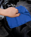 Hand using blue Ultra Absorbent Cotton Shop Towels Pack Of 50 12 By 14 Inches Super Soft Rags for auto care on engine