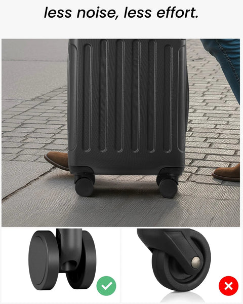 Black hardside luggage on four spinner wheels; front view of suitcase on pavement.
