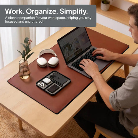 Person using laptop beside Pebble Black Vegan Leather Valet Tray For Nightstand, 9.5 By 7.9 Inch Medium Catchall Organizer.