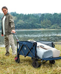 Person pulling Extra Long Folding Wagon With Tailgate And Brakes For Easy Haul near lake, heavy duty cart