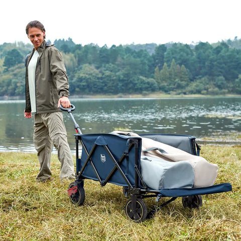Person pulling Extra Long Folding Wagon With Tailgate And Brakes For Easy Haul near lake, heavy duty cart