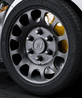 Close-up of 12x1.5 Lug Nuts 6 Spline Extended ET Closed End 24 Pc Set M12x1.5 With 7.6mm Shank on a 6-lug aftermarket wheel