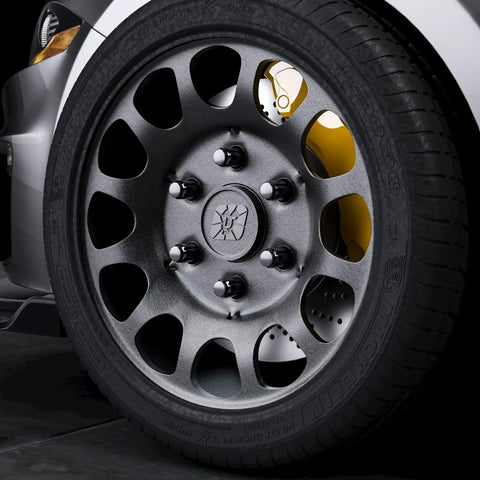 Close-up of 12x1.5 Lug Nuts 6 Spline Extended ET Closed End 24 Pc Set M12x1.5 With 7.6mm Shank on a 6-lug aftermarket wheel