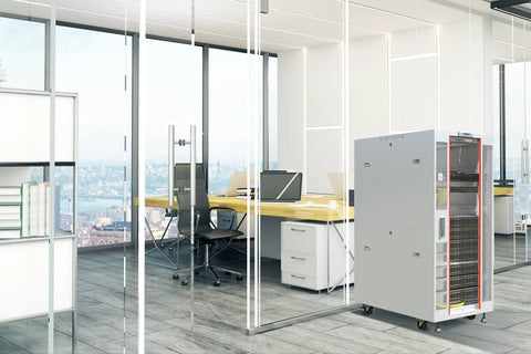 Beast Mode 32U Gray Floor Standing Server Rack Cabinet 35 Inch Deep With Built In Cooling Fan Removable Side Panels Locking Glass Door in office.
