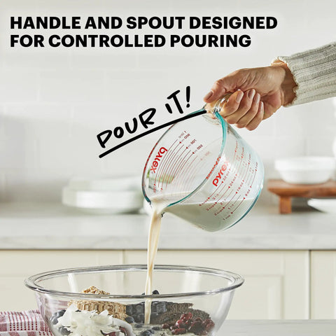 Three Piece Glass Measuring Cups Set With 1 Cup 2 Cup And 4 Cup Sizes for Prep Bake and Cook pouring liquid into bowl in kitchen
