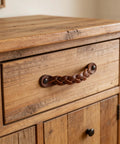 Braided cognac leather drawer pull installed on wooden dresser, 6-1/2 x 1 inch, rustic industrial hardware