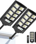 Heavy Duty Solar Flood Lights Outdoor 6000K LED Waterproof Motion Sensor With Remote Dusk To Dawn Security Light Built Tough And Holds Up Like A Champ For Your Yard Patio Walkway 2 Pack mounted and angled view