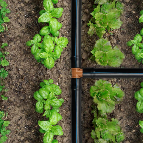 Garden with green plants using 35 Pieces 1/2 Inch Barbed Tee Fittings For Drip Irrigation Tubing, 3-Way Connector Set