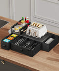 Coffee Pod Drawer Organizer For Countertop That Holds 52 Pods K Cup And Nespresso Capsules With Mug Rack No Brainer Setup For Your Kitchen Office Or Coffee Bar Black next to a toaster on a kitchen counter.