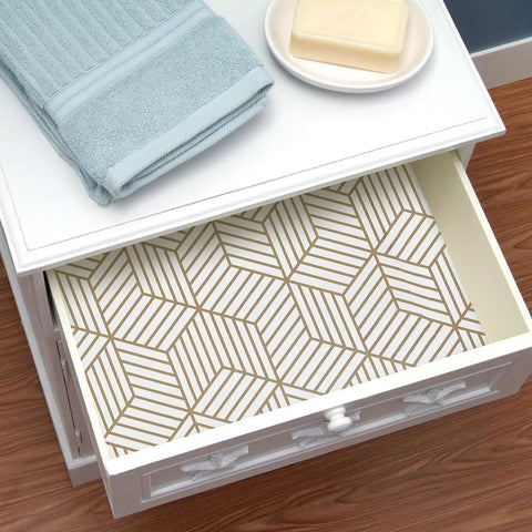 Geometric Hexagon Peel And Stick Wallpaper Removable Self Adhesive Vinyl Film For Walls And Shelves And Drawers And Furniture 17.71 Inch By 118 Inch Roll Easy To Apply No Mess Home Makeovers lining a drawer with a soap and towel.