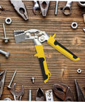 Ergonomic Hand Seamer Tool For Ductwork And Metal Panels With Non Slip Handles on wood surface with metal tools and screws