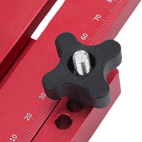 Close-up of Thin Jig Table Saw Guide Pro Grade With Secure Lock Design, red aluminum body, black lock knob, and measurement scale.