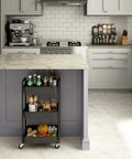 3 Tier Rolling Metal Storage Organizer Cart With Caster Wheels Mobile Utility Kitchen Cart For Home Office Garage And Craft Space Durable Powder Coated Steel With Mesh Shelves Black in a kitchen setting