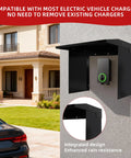 Badass Weatherproof EV Charger Cover For Tesla Wall Unit mounted on a house wall, black steel design protecting charger from rain.