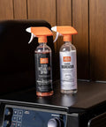 Heavy Duty Grill Cleaning Kit With Exterior Detailing Spray And Foaming Degreaser Bottles on Grill